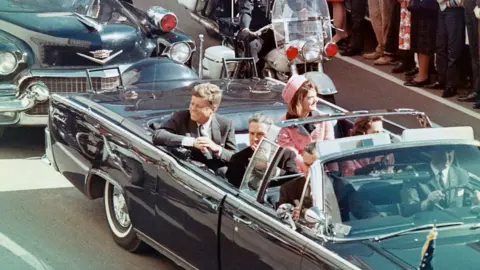 Getty Images Kennedy was shot by a sniper during a visit to Dallas, Texas, in 1963