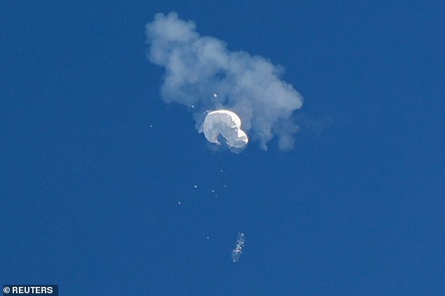 The suspected Chinese spy balloon drifts to the ocean after being shot down off the coast in Surfside Beach, South Carolina on February 4, 2023