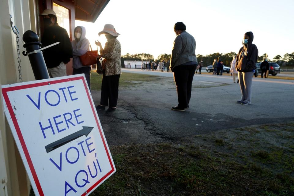 People line up to vote in Atlanta in 2020. The Cobb County Board of Commissioners approved funding to buy panic buttons for election workers amid rising threats against them (AFP via Getty Images)