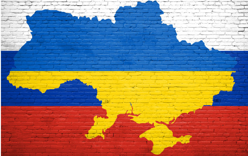 Flag of Ukraine and Russia painted on a brick wall.