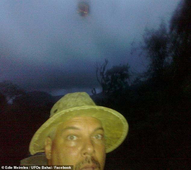 In a recent, March 2022 post to the group UFOs Bahai  on Facebook, Meireles boasted that his candid snap was 'the only selfie with a flying saucer.' Above, a second and less clear 'UFO selfie' from Meireles' alleged encounter with a flying orb in Chapada Diamantina national park