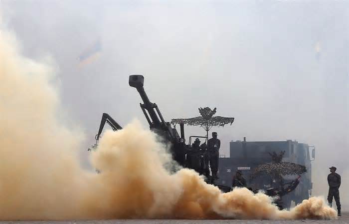 Indian Army soldiers participate in a mock drill exercise during the Army Day parade in New Delhi