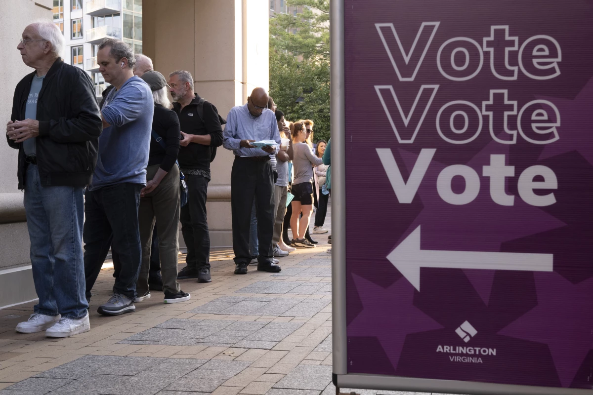 Voters line up to cast their ballot as early voting starts in Arlington, Va., on Sept. 20, 2024.