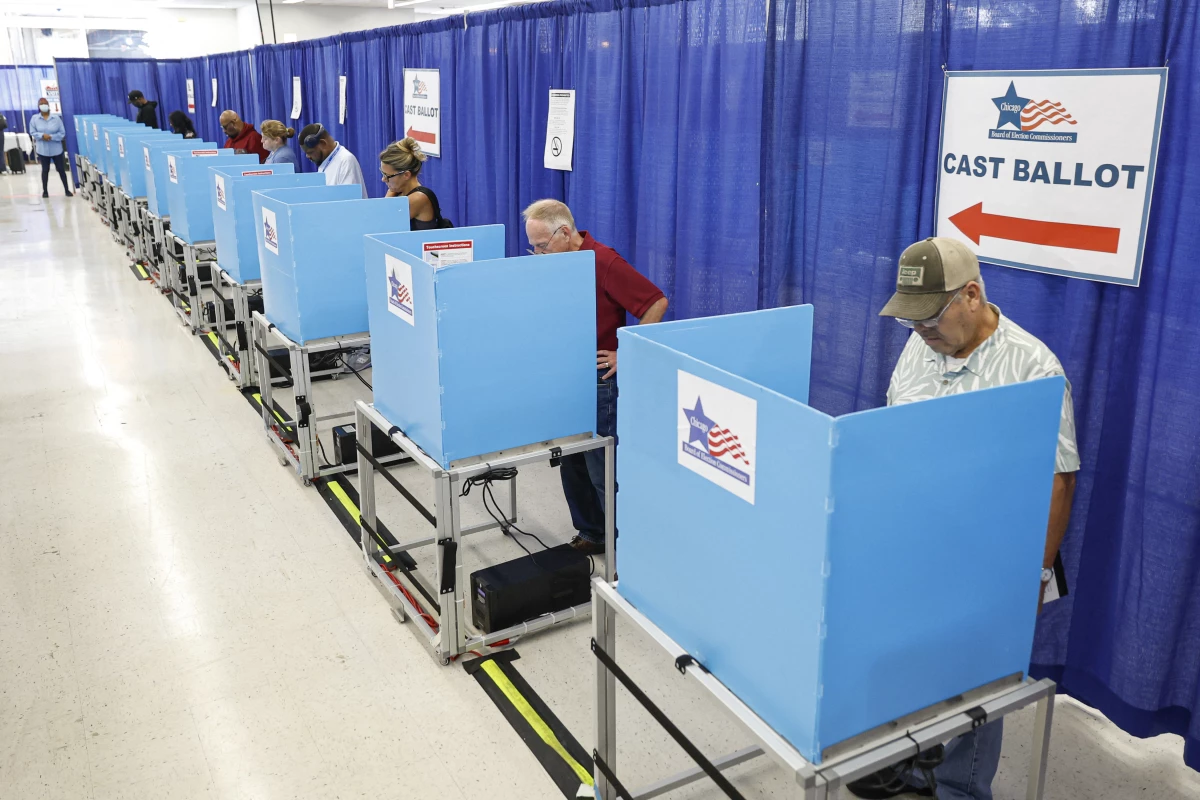 Voters fill out their ballots on the second day of early voting in the 2024 presidential election at the Board of Elections Loop Super Site in Chicago, Illinois, on Oct. 4, 2024.