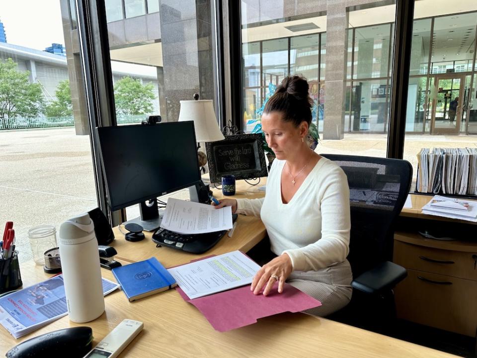 Kent County Clerk Michigan Lisa Posthumus Lyons sits at her desk.