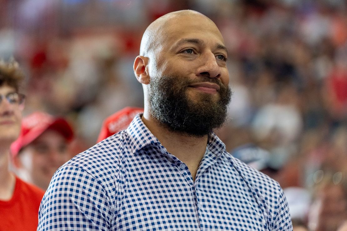 Royce White, candidate for U.S. Senate, listens as Republican presidential candidate former President Donald Trump speaks at a campaign rally, July 27, 2024, in St. Cloud, Minn. (AP Photo/Alex Brandon)