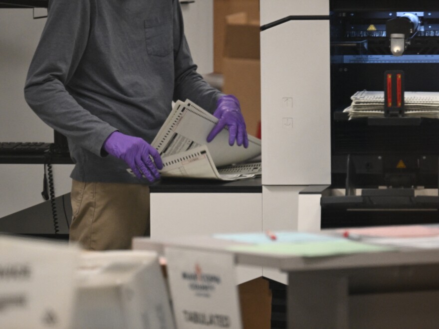 An election worker counts ballots inside the Maricopa County Tabulation and Election Center (MCTEC), November 6, 2024 in Phoenix, Arizona. (Photo by Patrick T. Fallon / AFP) (Photo by PATRICK T. FALLON/AFP via Getty Images)