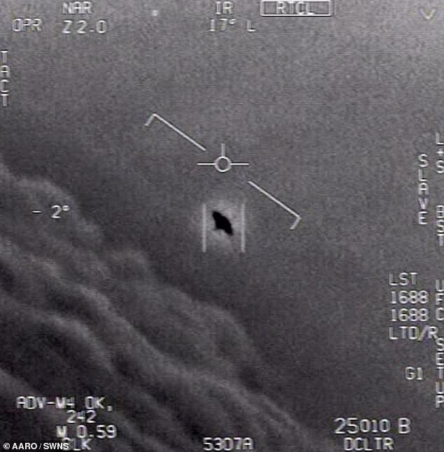 A bombshell report on the US government's top-secret UFO data retrieval program has revealed shocking evidence of Non-Human Intelligence (NHI) on Earth. Above, a still from a previously released unclassified US government video appears to show a UAP.