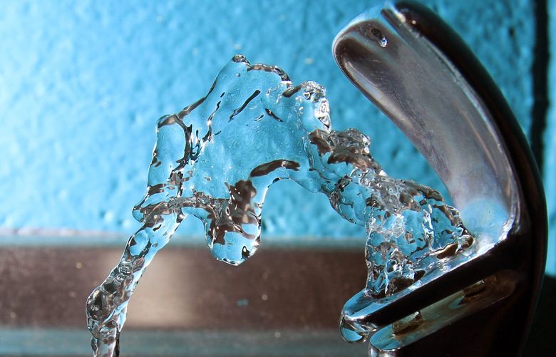 FILE – Water flows from a water fountain in Concord, N.H., on Friday, Jan. 7, 2011. (AP Photo/Jim Cole, File) NY476 NY476