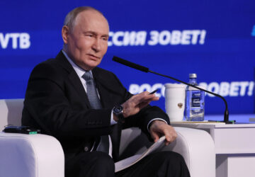 Russian President Vladimir Putin speaks during a plenary session of the VTB Investment Forum 'Russia Calling' in Moscow, Russia, Wednesday, Dec. 4, 2024. (Yuri Kochetkov/Pool Photo via AP)