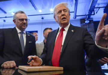 FILE - Republican presidential nominee former President Donald Trump signs autographs as Massad Boulos listens during a visit to The Great Commoner, Nov. 1, 2024, in Dearborn, Mich. (AP Photo/Julia Demaree Nikhinson, File)