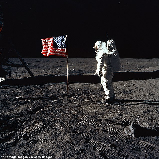 Although it is regarded as one of humanity's greatest achievements, a delay to NASA's Artemis program has triggered a surge in conspiracy theories denying the existence of the moon landings. Pictured: Buzz Aldrin stands on the lunar surface in 1969