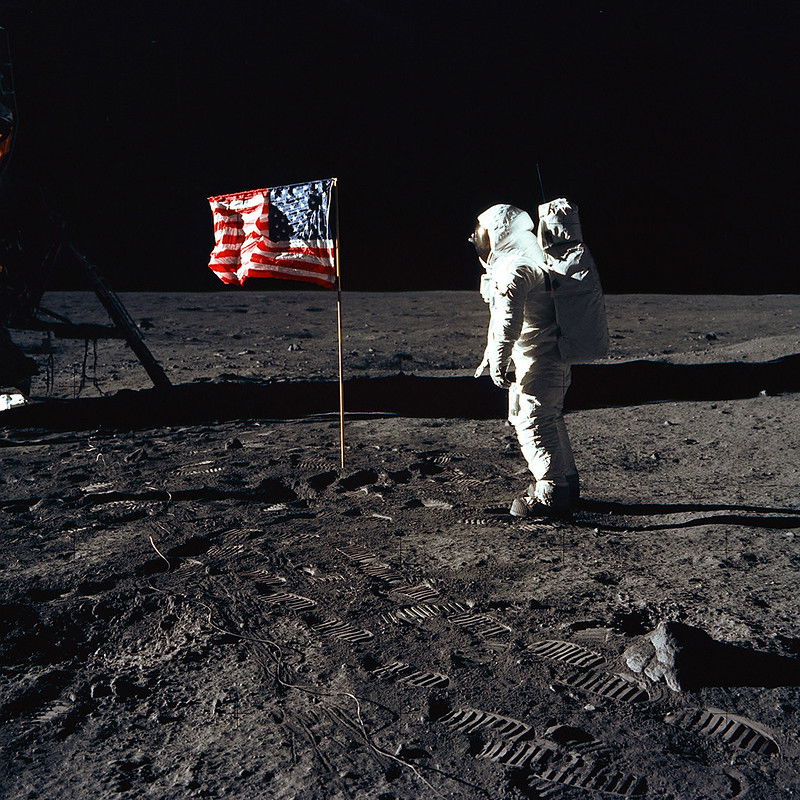 Aldrin standing by the US flag on moon