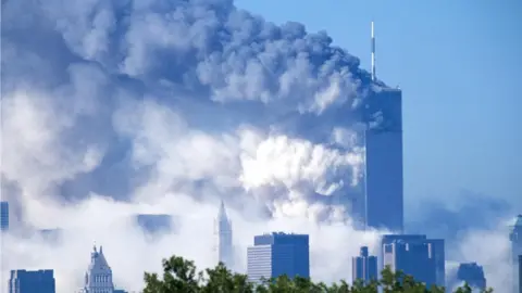 Getty Images Two commercial jet liners crash into the World Trade Center, consequently causing both towers to implode and fall