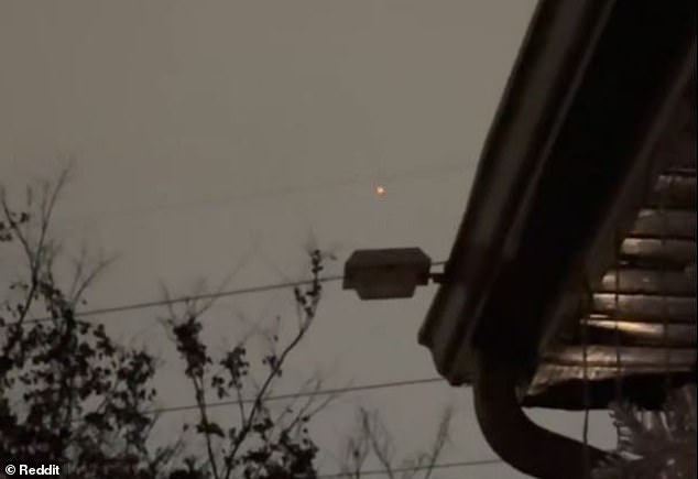 An anonymous user on Reddit captured footage of a mystifying 'bright orange light' flying relatively low as it traveled over Fort Campbell - a military base along the Tennessee-Kentucky border, on New Year's Day