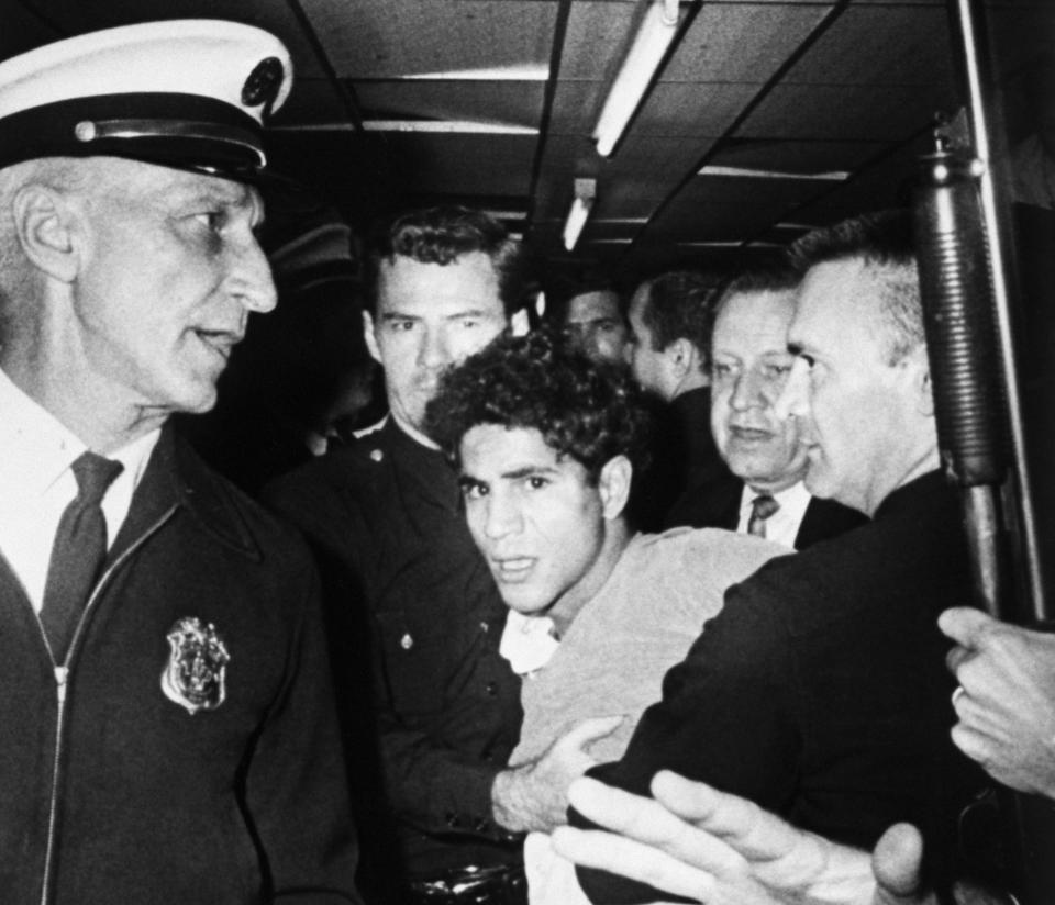 Sirhan Sirhan, 24, being led away from the Ambassador Hotel after he shot Robert F Kennedy, June 5 1968