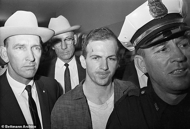 Oswald shown after his arrest. He was later shot dead by nightclub owner Jack Ruby in a moment captured live on television