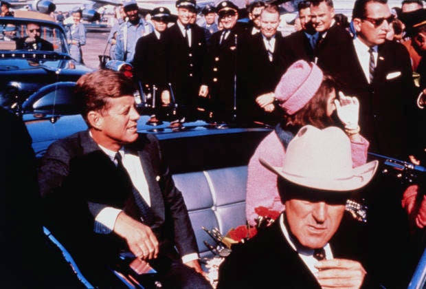 President John F. Kennedy and first lady Jacqueline Kennedy in their motorcade in Dallas 