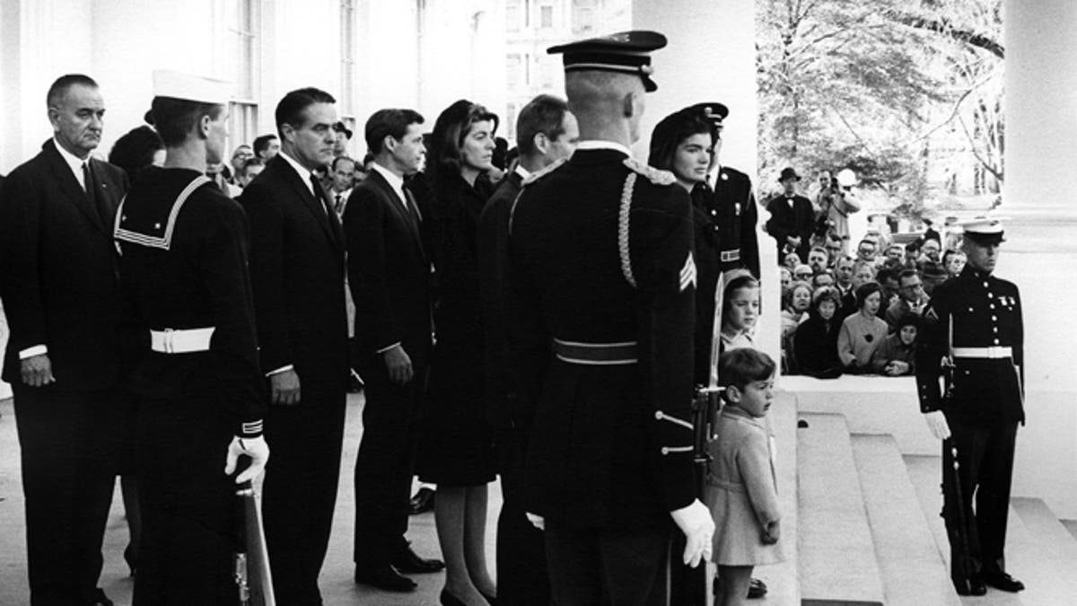 President Johnson, R. Sargent Shriver, Steven Smith, Patricia Kennedy Lawford, Attorney General Robert F. Kennedy, Mrs. Jacqueline Kennedy, John F. Kennedy, Jr., Caroline Kennedy preparing for procession to Capitol.