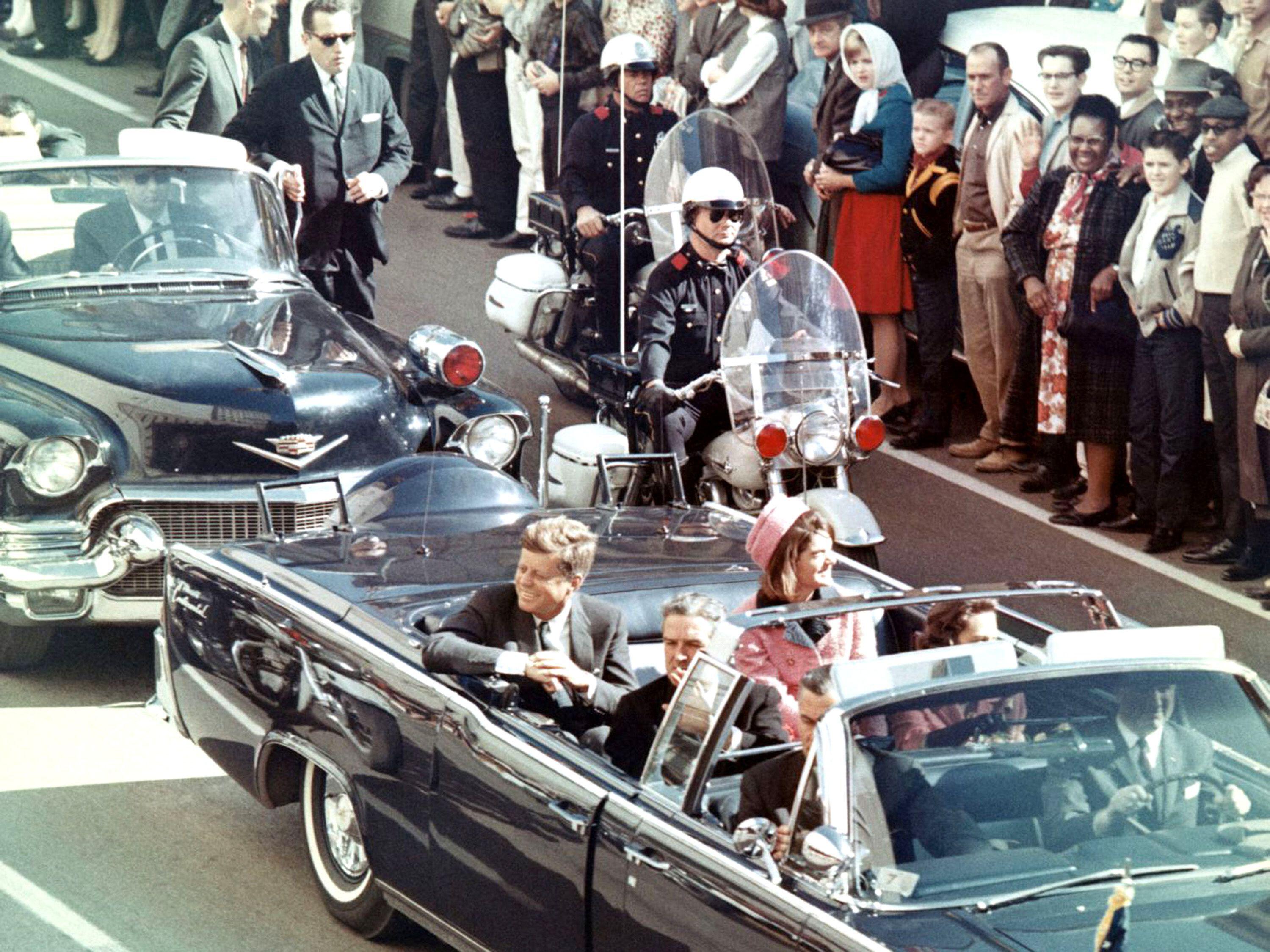 President Kennedy, Jackie Kennedy, Governor John Connally, and Nellie Connally in a motorcade moments before the assassination.