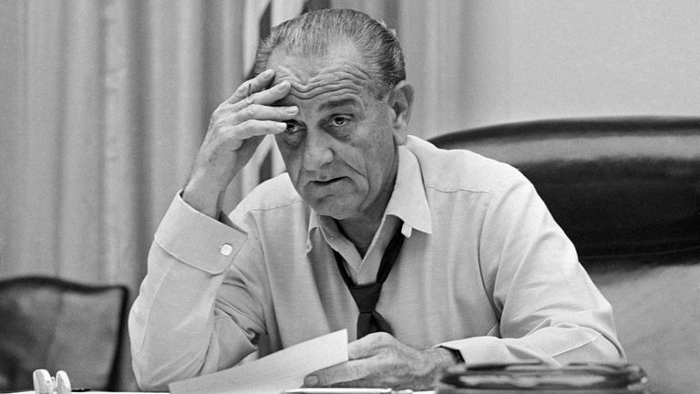 President Lyndon Johnson, in shirt sleeves and open collar, works on his speech in the White House Cabinet Room March 30, 1968. The following day the president announced to the nation that in order to devote himself to his duties, he would not seek or accept the nomination for re-election. (AP Photo/Bob Daugherty)