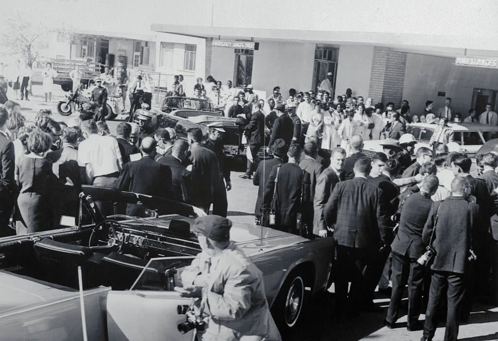 spectators gathering around hospital